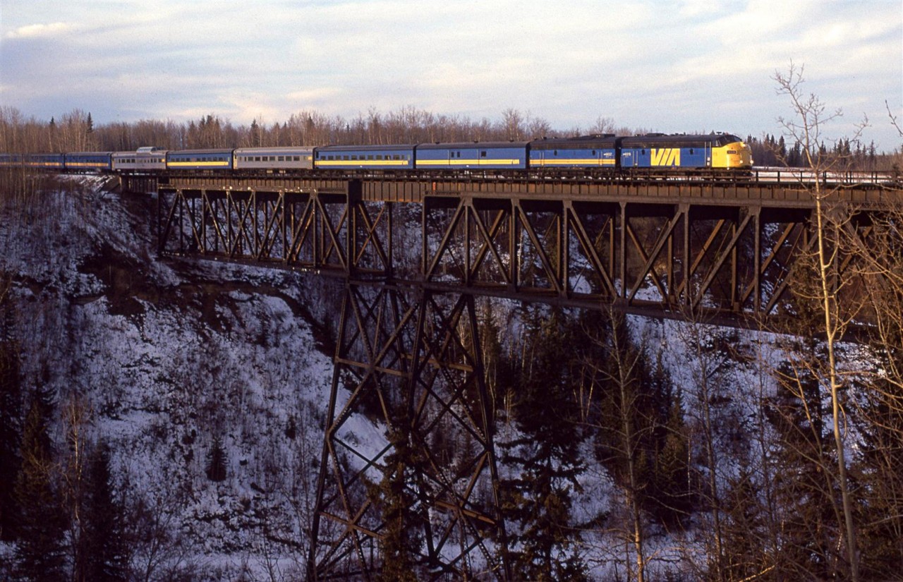 The eastbound combined #3 and #5 cross the impressive span over the Pembina River. The Super Continental is slightly longer than it was a couple days earlier as the Christmas crowds are building. That is the reason that the Skeena is not quite in sight attached to the rear of this train.