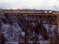 The eastbound combined #3 and #5 cross the impressive span over the Pembina River. The Super Continental is slightly longer than it was a couple days earlier as the Christmas crowds are building. That is the reason that the Skeena is not quite in sight attached to the rear of this train.