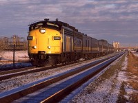 At 1515hrs, the westbound "Super Continental" blasts out of Edmonton. Bissell yard is just beyond the bridge in the background. Inland Cement's towers are also quite prominent.
This is the last photo that I took in the rather prolific railfanning year of 1986.