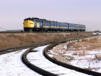 At 1325hrs, the westbound "Super Continental" is about to hit East Junction and head SW to the VIA station. These "drop down" sidings lead to the Swift Premium meat processing plant. The area here, on both sides of the tracks hosted stockyards - many of the paddocks were still in place at this time. There was even a "tunnel" passage under the tracks to connect the areas. These were not active in '87, though. 