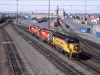 A quick stop in Calgary yielded a few shots from the Alyth Shop area. A leased Chessie System GP-40 addes some bright colour to the area. Note the small inter-modal yard. It looks to be an impound lot for towed cars now.