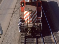 Wearing traditional RR attire this employee rides the old Geep back into the yard.