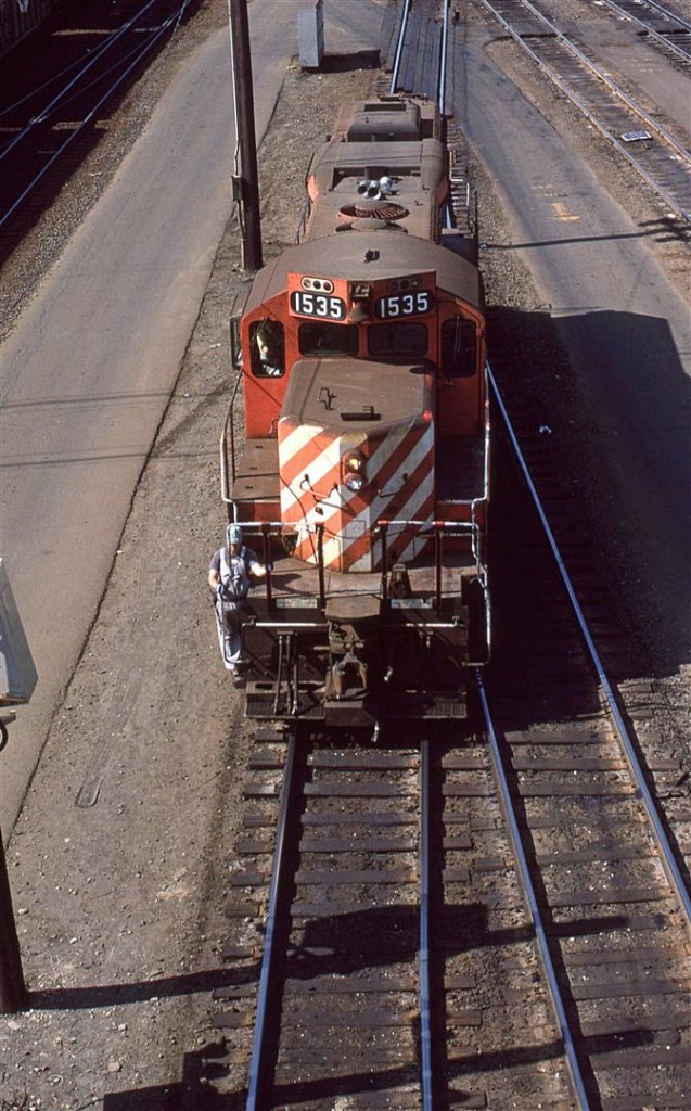 Wearing traditional RR attire this employee rides the old Geep back into the yard.