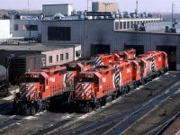 A typical mid-'80's view of the CP shops at Alyth - SD-40's and GP-38's. The four-axle set is likely the Exshaw Turn's power.
Note the "Canadian Pacific" sign on top of the building. I think that might have been a recent (at the time) addition (Or, maybe, I did not notice it there before - a very likely scenario). 