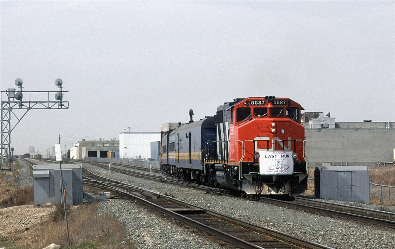 In one of those cases of, "It's better to be lucky than good", I caught the last mixed train to Waterways (Fort McMurray). I had seen it in the VIA timetable and meant to catch it one day. Finally, when I made the time, I got out there to capture the last one. Go figure.
This train did not leave from the VIA station in downtown Edmonton. Rather it picked up passengers at a shack adjacent to Fort Road. There was no platform, nor was the shack open for shelter. There was, however a tiny parking lot.
Note the significant smoke stacks on the passenger cars - no HEP or steam for heat on this train.