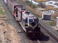 I arrived in Edmonton as things were becoming relatively boring. The NAR was absorbed into CN and the downtown rail facilities were being rationalized. (by coincidence, I would leave Edmonton as things were becoming more interesting by having CN spin off a number of their branch line operations.)
Here, we have an eastbound Work Extra returning to town, led by an ex NAR GP-9. I don't think CN was really quick to repaint the NAR units but they were still rare to see, but at least twice I saw them of the wrecker train.