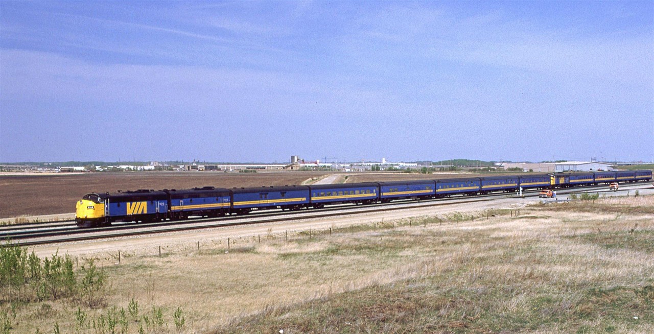 After the eastbound "Super Continental" met its westbound counterpart at Bissell, the combined westbound "Super Continental" and "Skeena" get underway. ....and not one stainless steel car in the consist.