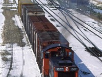 This is my other photograph taken on May 20, after a 20 cm snowfall. It is only 1000hrs but with the sun out now, the snow is melting fast.
This switcher has completed their task in Zone M (off to the left of the photo) and is heading back to Calder Yard.