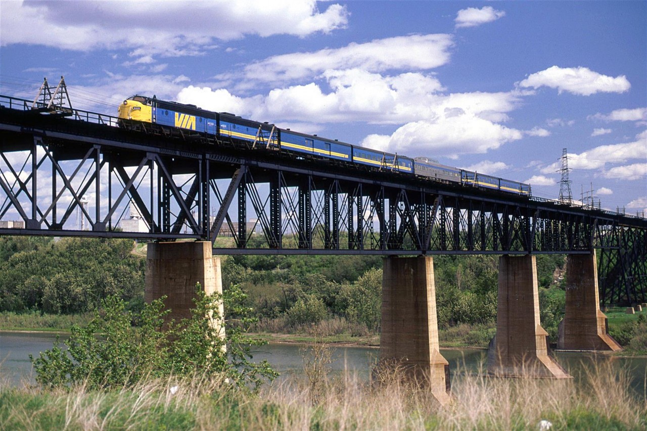 Another shot on the high bridge over the North Saskatchewan River as the train enters Edmonton from the east.
Because it is summer-ish, the "Super Continental" warrants a stainless steel dome car. That is probably good for the passengers but it screws up the aesthetics.