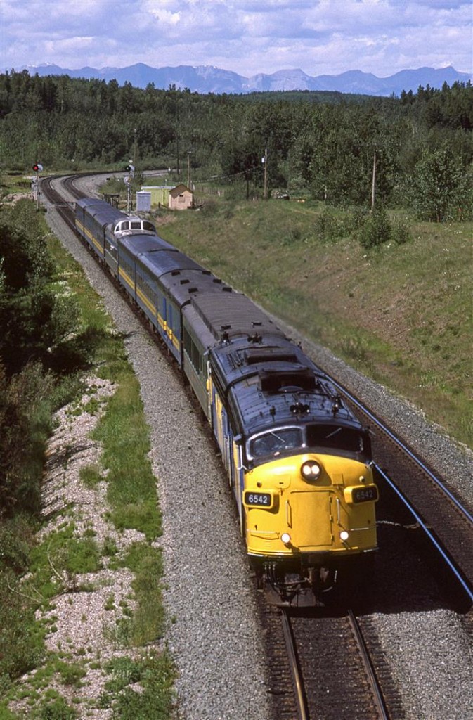 On the longest day of the year (don't bother to star watch, because it really doesn't get that dark), at 5 til noon, the eastbound "Super Continental" is about to pass under the Yellowhead highway (Highway 16).