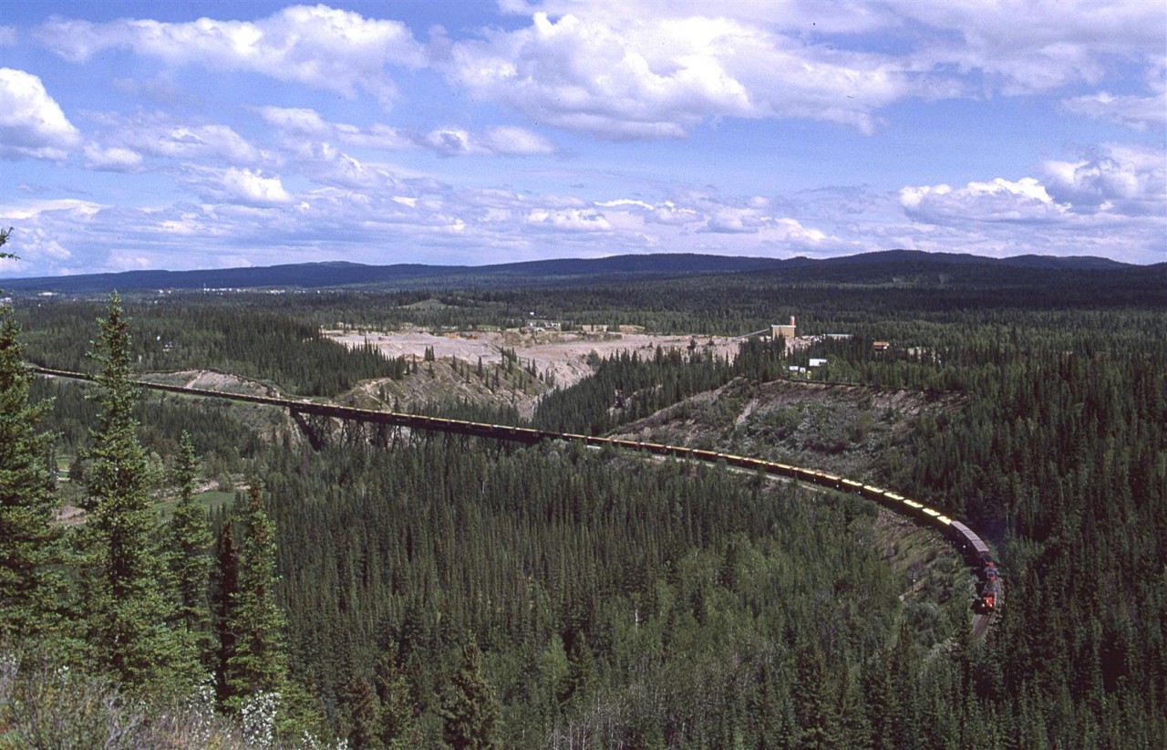 A loaded Sulphur train (with a few box cars tacked on to fill out the weight) crosses Maskuta Creek, just west of Hinton.