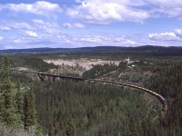 A loaded Sulphur train (with a few box cars tacked on to fill out the weight) crosses Maskuta Creek, just west of Hinton.