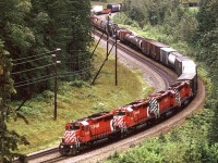 It took me a while to locate where I photographed this train. Google Streetview showed that the trees along the highway have obscured this view.This is an eastbound manifest working hard up the west slope of Rogers Pass.