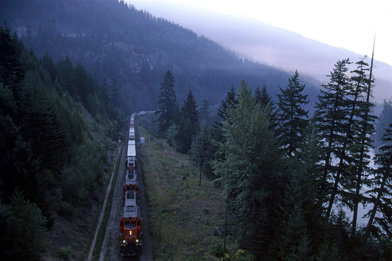 Well before the sun would reach the valley floor, an eastbound COFC train is seen in the heart of the Fraser Canyon between Hope and Boston Bar.