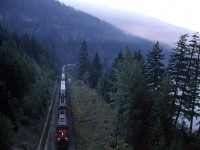 Well before the sun would reach the valley floor, an eastbound COFC train is seen in the heart of the Fraser Canyon between Hope and Boston Bar.