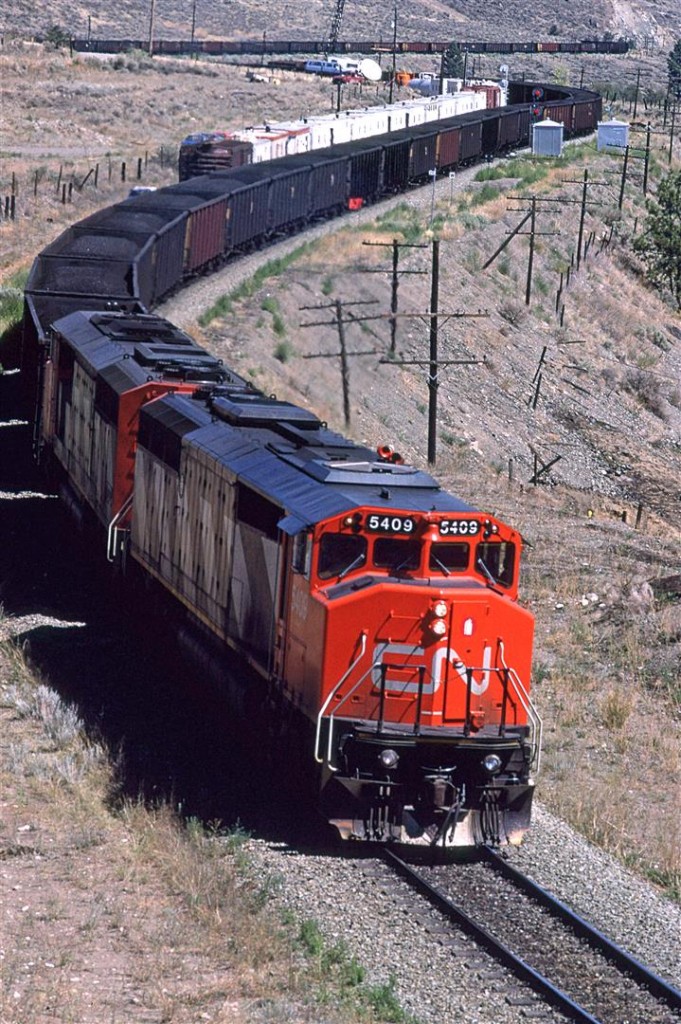 Although not quite visible in this photo, Savona is at the outlet of the large Kamloops Lake. There is no dam.
This coal train powered by just two SD50F's (a normal contingent) had come out of the coal fields around Hinton and Edson, and will go to Roberts Bank for export.
There looks to be a work/bunk train parked on the siding.