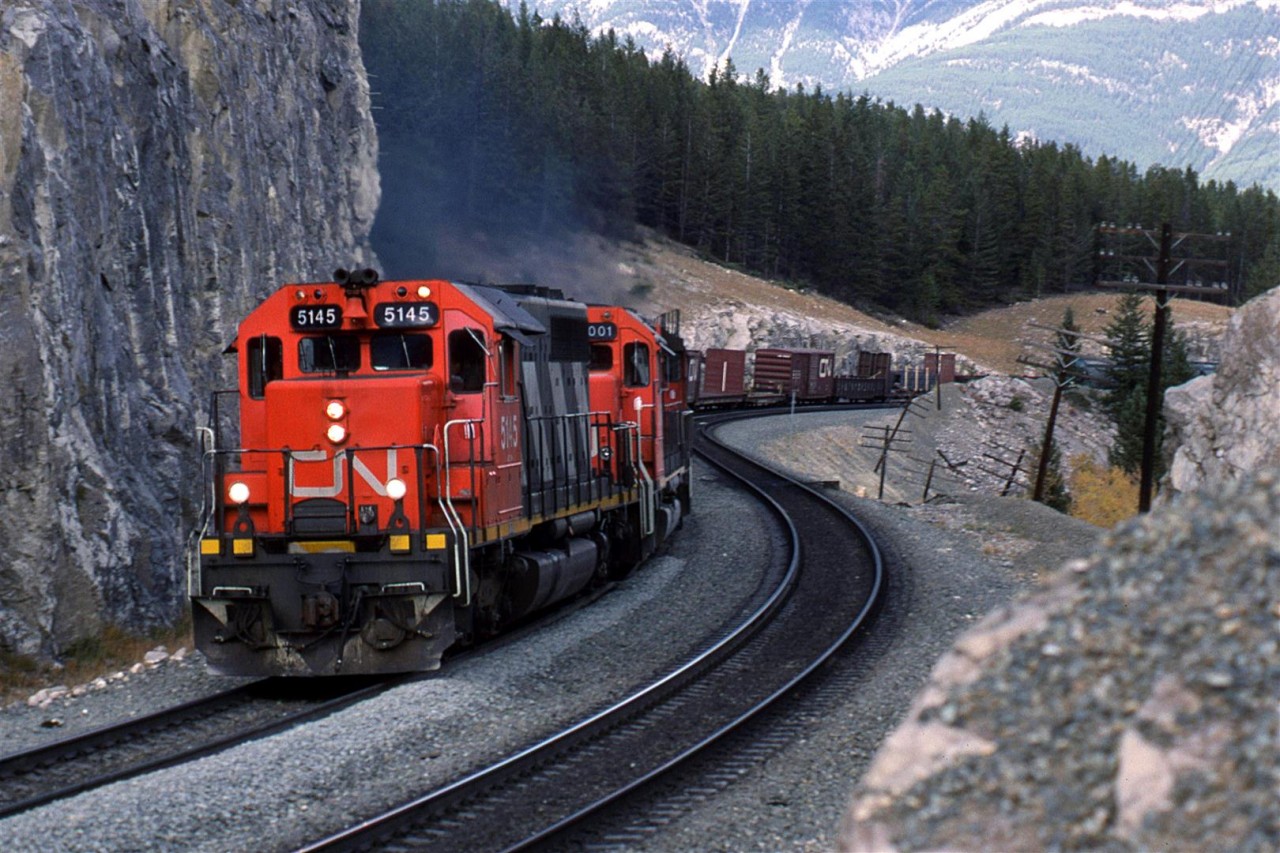 This is a classic location, just east of Jasper. CN had only recently finished double tracking the area, as evident by the fresh rock cutting and dirt-work.
This is a westbound train that might have come out of Edmonton, but I think that it is just as likely to have come down the Grande Cache Sub.