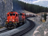 This is a classic location, just east of Jasper. CN had only recently finished double tracking the area, as evident by the fresh rock cutting and dirt-work.
This is a westbound train that might have come out of Edmonton, but I think that it is just as likely to have come down the Grande Cache Sub. 