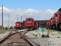 Tracks 1 & 2 west of plant #2 at Agincourt Yard are occupied by 4 axle power while track 3 to the right is yet another filled with stored SD40-2's.