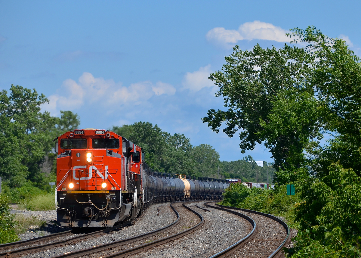 Through the s-curve. CN 8884 leads a 108-car CN 377 through the s-curve as the train approaches Dorval station.