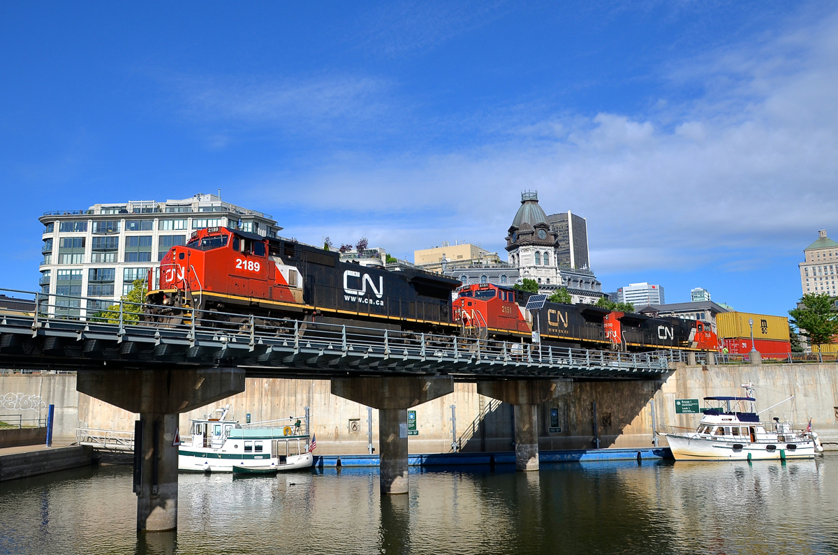 A pair of ex-Super Fleet units up front. CN 2189 & CN 2151 (originally ATSF 854 & ATSF 832, Super Fleet Dash8-40CW's) along with CN 2636 lead CN 149 over the Lachine Canal. This shorter than usual intermodal train is 9,868 feet/438 axles long.