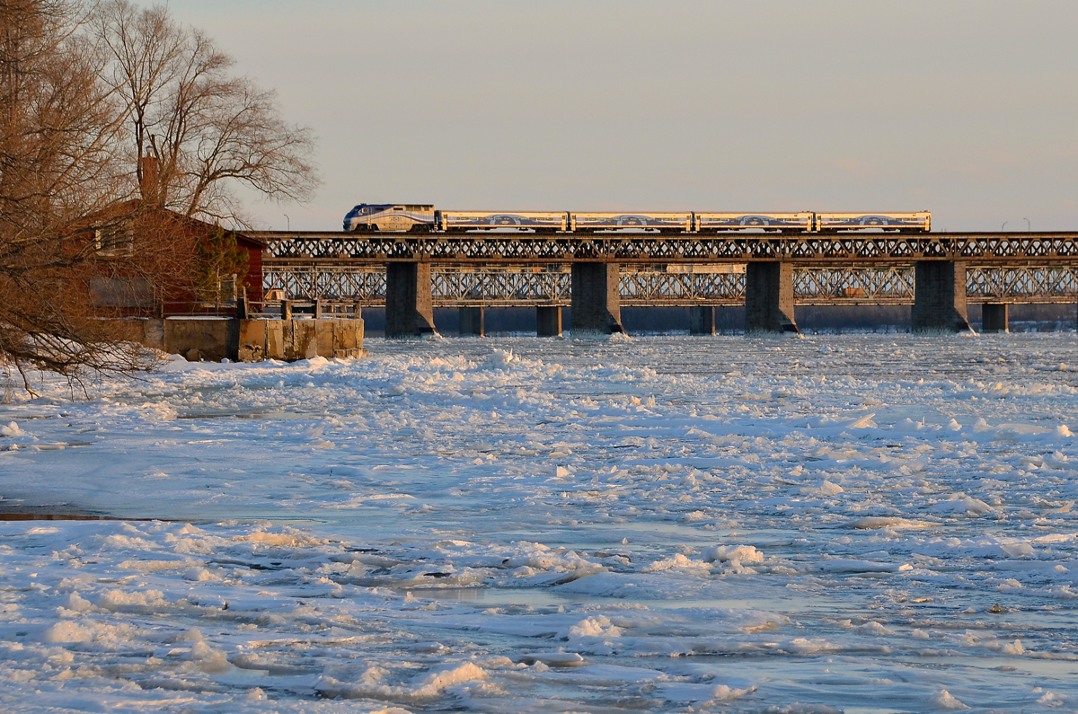 Something to cool you down. AMT 1322 pushes AMT 75 for Candiac over the mostly frozen St-Lawrence river this past January.