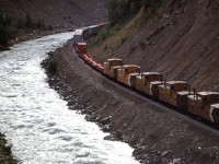 In order to show my railfan acquaintance how one can chase a train from the summit of Kicking Horse Pass all the way to Golden - the area covered by his planned guide, we decided to chase this train. The next several photos were all taken from roadside locations. This was our ninth shot, taken at pretty much the same spot as the eighth. As I said earlier, there was just about everything on this train, including 5 vans. We did not give chase into Golden as the photo ops are few, and are dangerous to access. Stopping along that stretch of road was not a good idea, nor was having to cross the road to get the view. There are a few places where photos may be had, but they are best left for eastbounds.