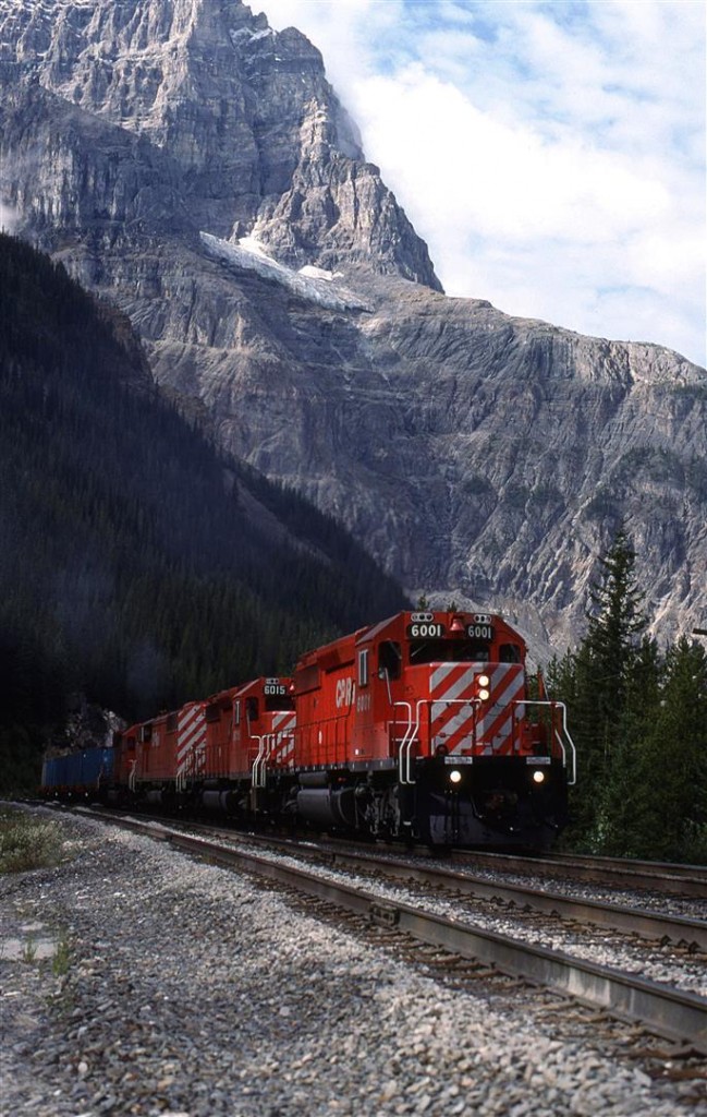 This eastbound train had just about anything that CP had in the yard behind the draw bar. There were containers (on flat cars), LPG tank cars and even crumby old gondolas to fill out the weight. The "Red Barns" were new to CP at the time, and that was one of the reasons why were were at Kicking Horse Pass. The other was that a railfan acquaintance was putting together a guide for the area from Lake Louise to Golden. I gave up on helping with that once I learned that he was only going to use the photos from this one trip. I really did not think that we covered the area well enough. He published it anyway.