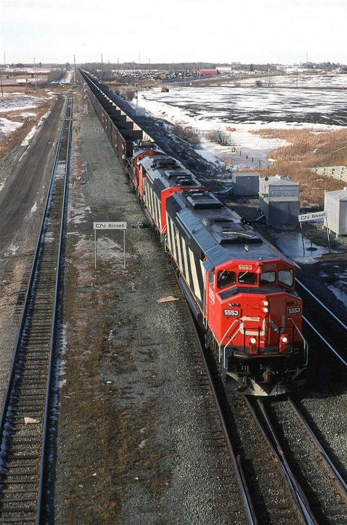 This might be the first photo that I have submitted of a SD60F. I don't think that we saw the original 3 "demonstrator" units out west very often, and all the subsequent units were constructed in 1989.
This is an empty sulphur train arriving from North Vancouver, at Edmonton's Bissell Yard. The power will be removed and eventually new power will replace the caboose on the west end. A caboose will be placed on the east end for the westbound journey from Edmonton to the sour gas fields west of Whitecourt on the Sangudo Sub.