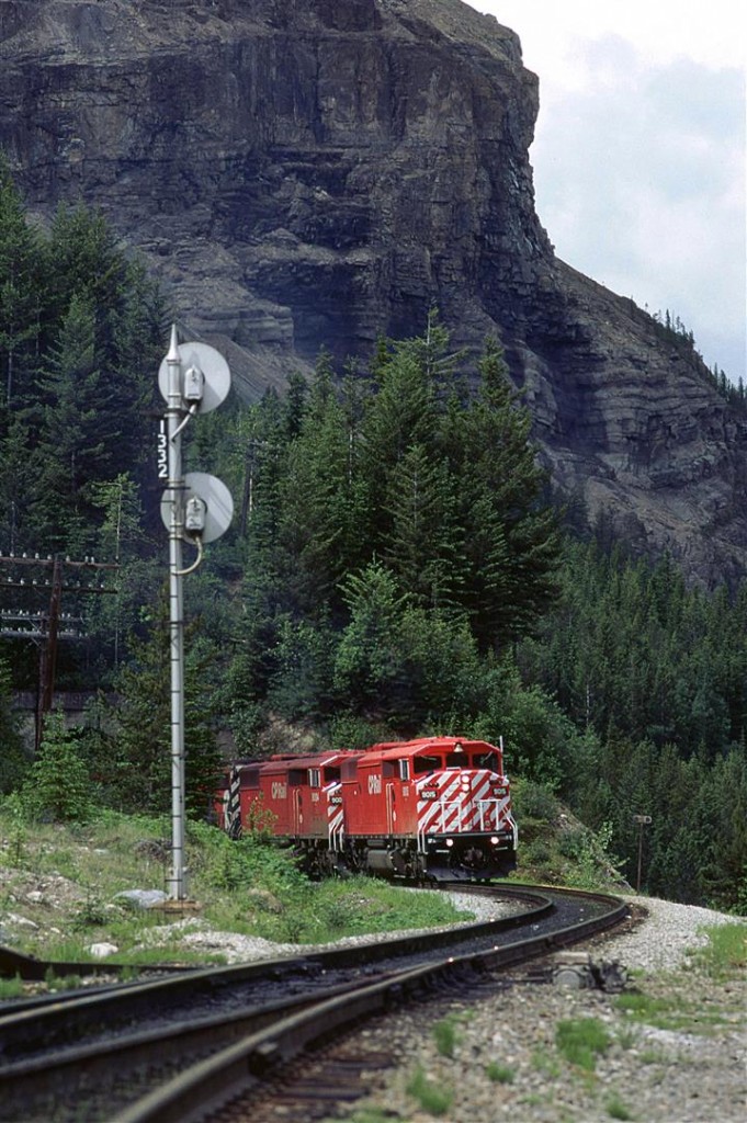 A couple of "Red Barns" lead this eastbound train up Kicking Horse Pass just west of Cathedral siding.