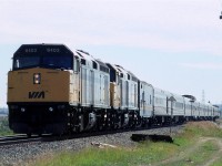 This is my first photo of the "Canadian" running trough Edmonton. With the demise of the "Super Continental", VIA had lots of surplus equipment, therefore there were no more mixes of old and new power on the transcontinental trains, and stainless steel cars dominated the scene.
The unfortunate souls on this particular train were forced on to a bus because of a track closure west of Edmonton. The westbound train terminated in Edmonton, and this became train #2. It has backed up the spur from downtown Edmonton and is continuing to back down the Wainwright Sub to Bretville Junction. It will use the wye at that junction to reverse direction and return to Toronto.
It looks like the double tracking at Bailey is not complete at this time. The tracks don't look to be fully installed and the signals for the end of the double track are still turned to the side.