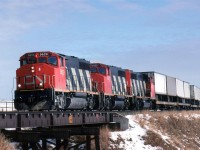 TOFC was still king in intermodal in early 1991 in Canada. This is only of their "hot" train on the eastern outskirts of Edmonton. It must been during the winter thaw since I doubt that I would have bicycled (or been able to bicycle) out there it it were -20 degrees or colder outside.