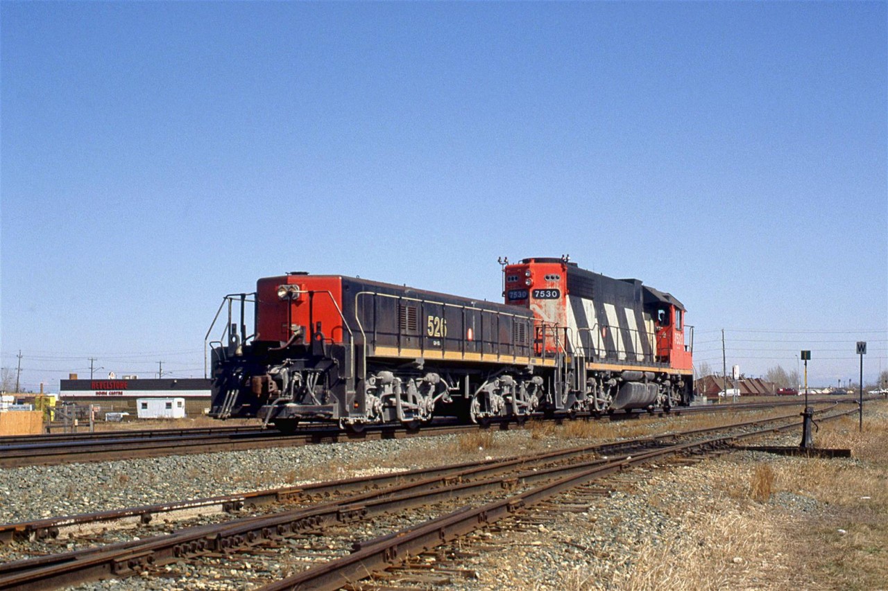 This power set looks like it has spend some time working the Inland Cement plant in west Edmonton. The dust almost makes it look like the trucks are painted silver, like Sante Fe RR.