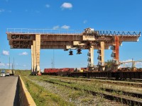 The electrically powered container lifting cranes are out of commission at the Intermodal Yard. They are clustered at the North end of their tracks awaiting their fate.