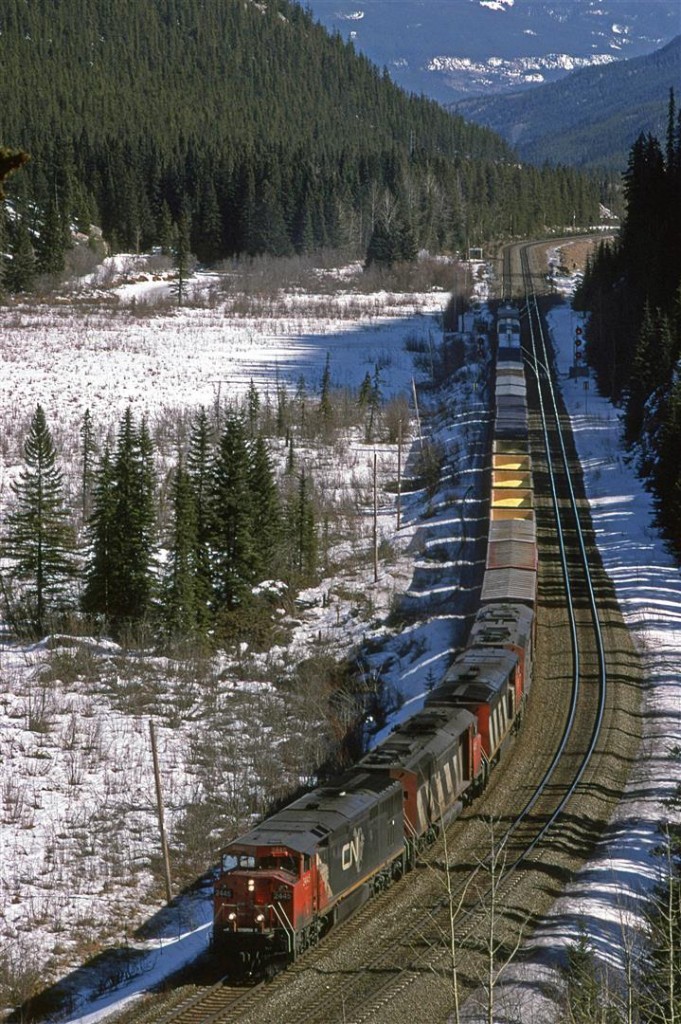 A very short and highly overpowered westbound manifest train has just left Jasper and is at the standard photo location of Geikie.