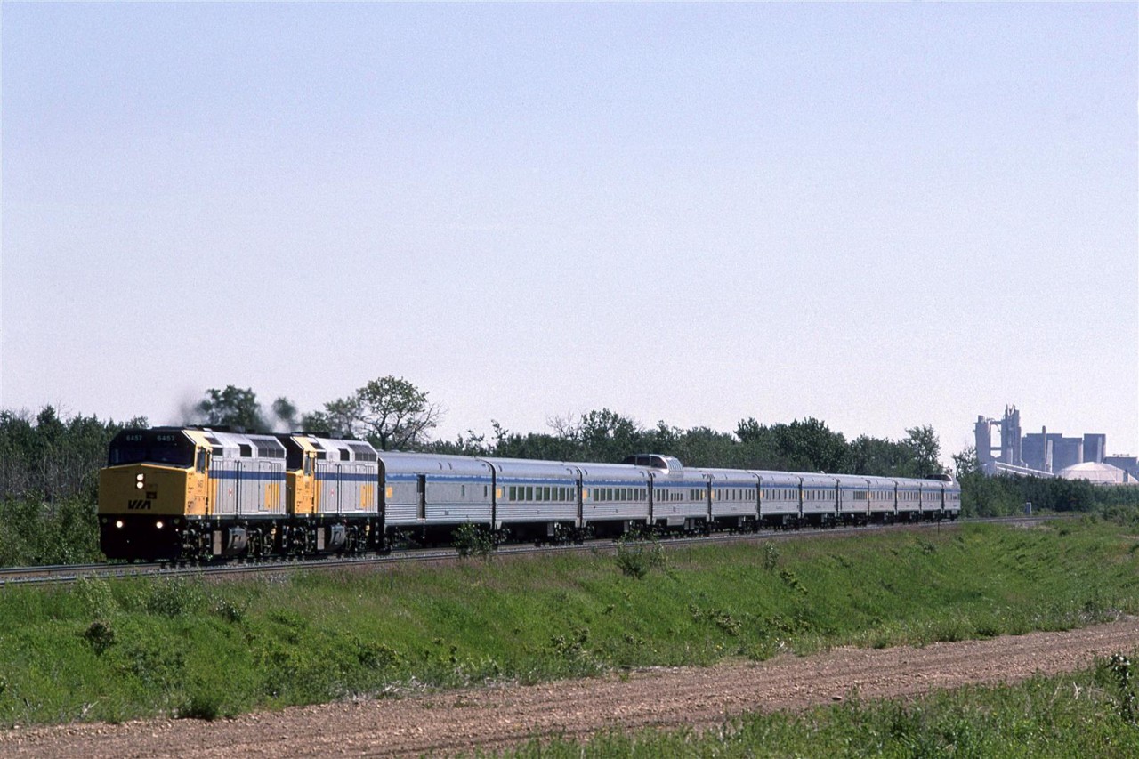 VIA's westbound "Canadian" leaves Edmonton, just west of Bissel Yard. The graded dirt area will be a shoe-fly in the coming months as a bridge is built for the tracks. Anthony Henday Drive will soon come through here.