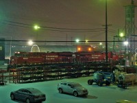 It's a blustery January night but the trains must roll on as CP 8943 heads up a consist being serviced.