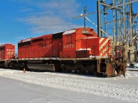 This SD40-2 was converted to a B unit in October 1991. Windows were blanked out and cab amenities (seats,fridge,hotplate,etc.) were removed. Here it had been declared surplus and already had it's crossing bell and ditch light assemblies removed as well.