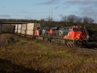 During a brief period of sun this morning CN Q148 curves out of Brantford at Garden Ave with a pair of ES44AC's