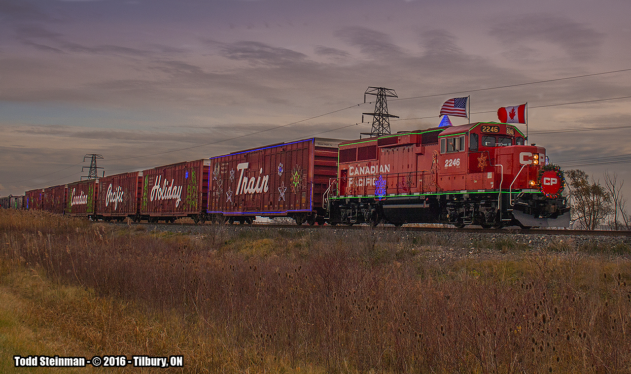 The 2016 edition of the "US" Holiday train for the Canadian Pacific. I last saw this train in Hamilton 5 years ago with a GEVO leading the way, and surprising to me was seeing the "little engine that could" in comparison - 2246 leading the charge. As I had planned to see this train in Windsor, my plans changed and I only made it to Tilbury. The 2016 edition of the "US" Holiday train for the Canadian Pacific....under threatening skies.


Until next year.....