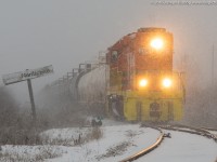 It was bitter, it was cold and it was snowy!  RLHH 2081 is seen lifting a cut of cars dropped off at the Nanticoke sign by RLHH 595 a little earlier.  2081 is working hard to get the train moving and would shortly be applying their horn for the crossing activating its unique alternating ditch lights.  Snow streamers this afternoon made visibility near to none for parts of Southern Ontario...Nanticoke not being the exception.