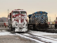 After having blasted through some snow drifts on it's way into the yard CP 8705 pauses for a brief stint alongside CEFX 1014 before being taken to the fuel stand to head out again on a busy Friday at Agincourt. The CEFX 1014 is one of the lease return units awaiting a shipment date.