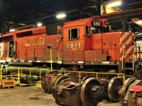 One of the last two large multimark painted locomotives SD40-2 5911 sits in plant #2.