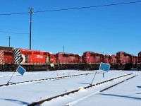 On this day the east end of the shop tracks displays SD40-2's in five different CP schemes. From the left 5906 in action red/no multimark 5697 with multimark 5857 & 6012 in faded CP Rail System dual flags 5560 in STL&H 6607 & 6621 in current Canadian Pacific block lettering.