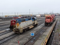 D&H GP38-2 7304 getting a shower at the west end of the shop. The SD40-2 CP 6007 is stored and will possibly be up for sale.