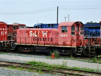 Originally a Milwaukee Road SW1200 built in 1954 STL&H slug daughter 1001 sits in the "retirement line". It was SOO 1211 before being converted. 