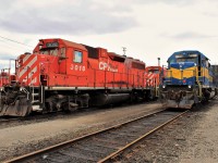 CP GP38AC 3018 built in 1971 rests outside the east end of the shop with sold ICE SD40-2 6213.