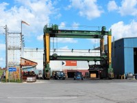 Mi Jack Hybrid container lifting crane in the inspection bay. Note the "vintage" CP Rail container used in the stack that provides wind protection for the inspection crews.