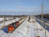 With the windchill showing a temperature of -36 Celsius (-32.8 Fahrenheit), somehow I'm on an overpass in Sainte-Anne-de-Bellevue to shoot CN 585 with two older EMD's for power (CN 5442 and CN 9411) and a solid TankTrain consist, destined for Maitland, Ontario.