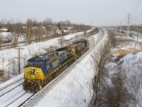 A pair of CSXT AC4400CW's still in the endangered YN2 paint scheme (CSXT 518 & CSXT 143) lead CN 327 around a curve in Beaconsfield on yet another frigid day.